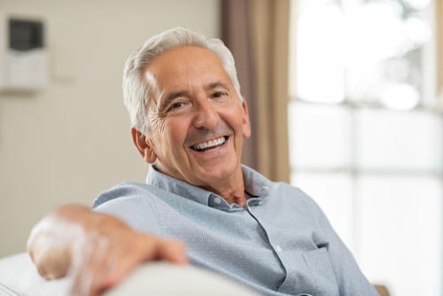 older man smiling after new Dental Implants in Long Beach, CA